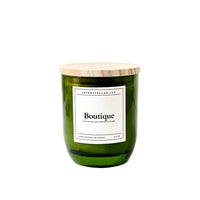 Green candle with a wooden lid on a white background